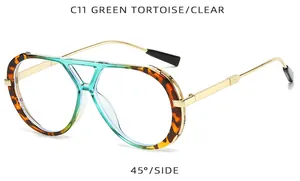 Side detail of retro double bridge sunglasses with green tortoise frame and clear lenses