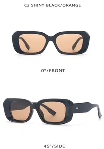 Gafas de sol rectangulares negro brillante con lentes naranjas en vistas detalladas.