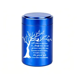 Detail of blue aluminum cremation urn with engraved white tree of life and memorial poem.