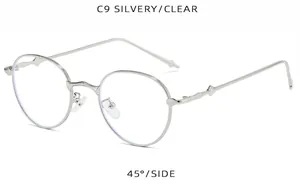 Montura de gafas redondas de metal plateado retro vista lateral de 45 grados detalles