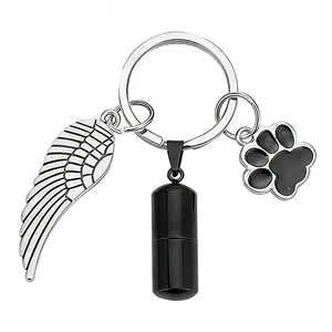 Cremation urn keychain for pet ashes with stainless steel wing and paw pendants