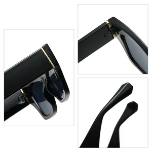 Lunettes de soleil œil de chat noires élégantes pour femmes avec détails dorés
