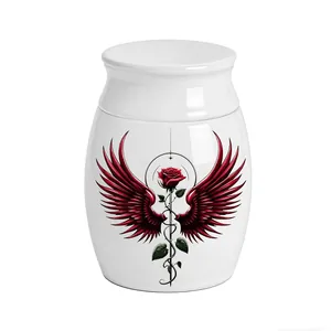 Close-up view of a white aluminum memorial urn featuring a red rose with wings design