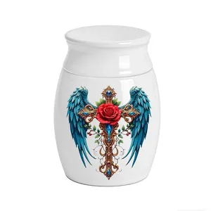 Detail view of white ceramic cremation urn featuring angel wings and red rose cross design