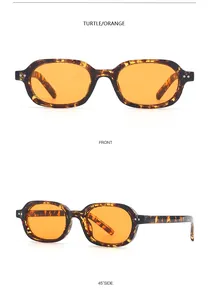 Detail view of retro small oval sunglasses with tortoise shell frame and orange lenses