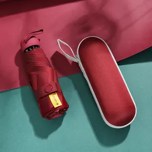 Compact burgundy five-fold sun umbrella with UPF50+ protection and capsule case