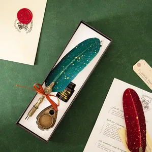 Retro feather pen set with engraved holder and ink, perfect for calligraphy and writing gifts.