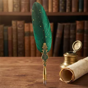 Elegant vintage green feather dip pen with ornate gold relief on a wooden desk