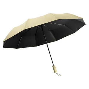 Large automatic folding umbrella in cream beige with black UV protection coating