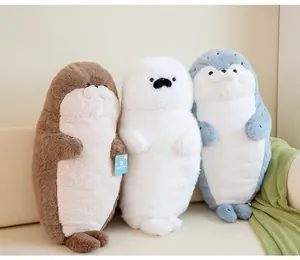 Trio of adorable seal and otter plush toys in brown, white, and grey with soft fur.