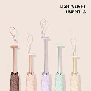 Ultralight 110g portable sun and rain umbrella available in multiple pastel colors.