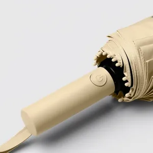 Beige automatic folding umbrella with one-button lightning fast open and close feature