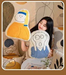 Detailed view of Asian woman holding funny parody plush pillows of famous art pieces.