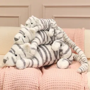 Peluche de tigre de nieve blanco en postura tumbada, suave almohada de animalitos