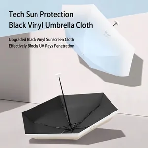 Compact gradient 6-fold sun umbrella with black UV coating for portable protection.
