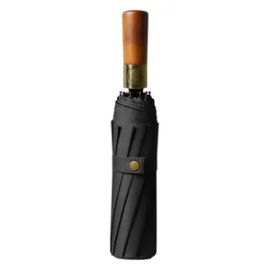 Automatic folding black umbrella with ergonomic wood handle and UV sun protection coating