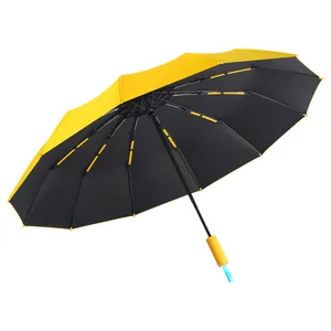 Large automatic folding sun and rain umbrella with yellow outer and black UV coating