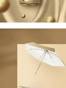 Macro view of a lightweight 5-fold sun umbrella with a sturdy white and gold frame