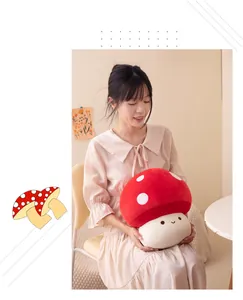 Detailed view of soft red mushroom plush toy held by a model in warm home setting.