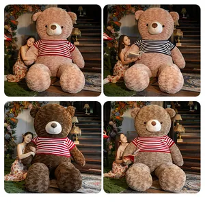Giant teddy bear plush toys in various colors wearing striped knit sweaters