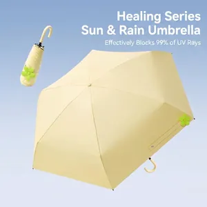 Cream yellow mini 5-fold sun umbrella with 99% UV protection and green flower detail