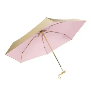Compact 5-fold sun umbrella with UV protection in pink and gold finish