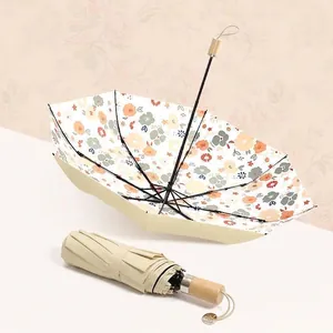 Sombrilla floral plegable portátil con protección UV y elegante exterior color crema