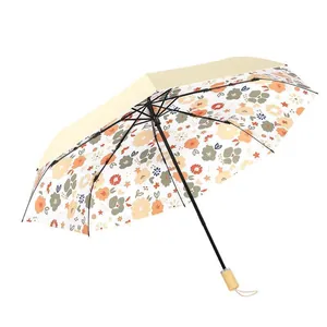 Paraguas plegable compacto con estampado floral para mujer y protección UV