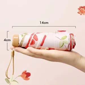 Compact 14cm floral folding umbrella with 240g lightweight design for sun protection