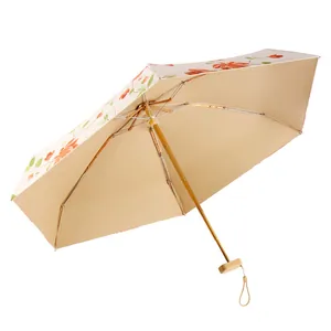 Elegant floral folding sun umbrella with UV protection and wood-style handle