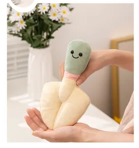 Macro view of a soft plush garden trowel toy showing the cute smiley face detail.