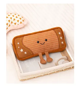 Detailed view of an adorable accordion style plush toy with a smiley face in a tray