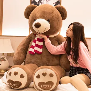 Giant brown plush teddy bear with striped scarf, a perfect gift for Valentine's Day.