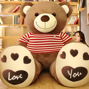 Giant brown teddy bear plush toy wearing striped sweater for Valentine's Day gift