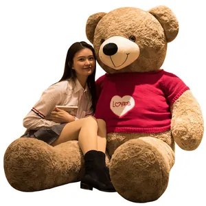 Giant brown teddy bear wearing a red loves sweater, perfect for Valentine's Day gift