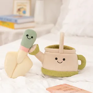 Adorable plush garden tool toy set featuring a smiling watering can and matching shovel