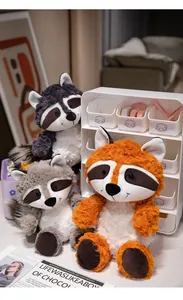 Detailed lifestyle shot of soft raccoon and fox plush toys in grey and orange colors
