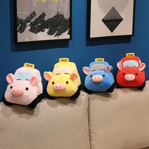 Set of cute cartoon pig-shaped taxi plush toys in four vibrant colors on a cozy sofa