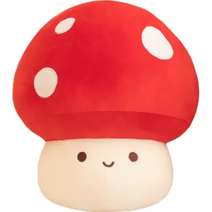 Cute red mushroom plush toy with white dots and smiling face on white background