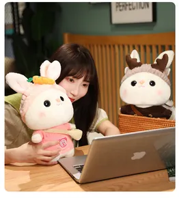 Detail showing cute white rabbit plush toys wearing sweaters in a lifestyle setting