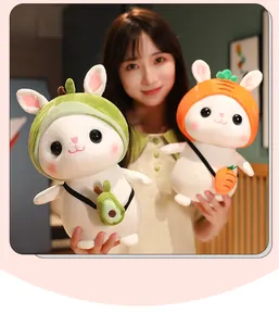 Asian model holding two cute cartoon rabbit plushies with avocado and carrot themes