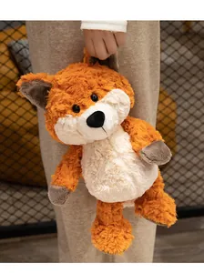 Soft plush fox toy held by hand showing high-quality fur texture and cute details