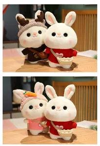 Detail showing various white bunny plush toy designs with cute sweaters and headbands