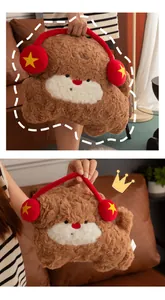 Detail showing fluffy texture of brown dog plush pillow with red headphone accents