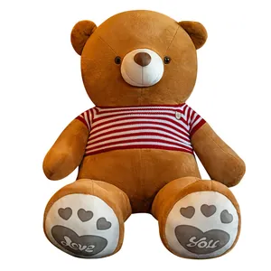 Large brown teddy bear plush toy wearing red striped sweater with Love You paws