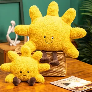 Soft yellow sun plush toy pillows with happy faces displayed in a cozy interior