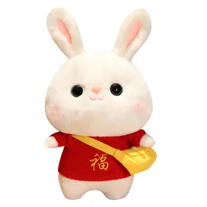 Cute plush white rabbit doll wearing a red sweater with Fu character and yellow bag