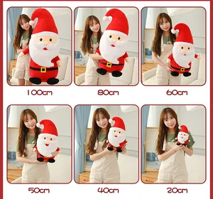 Santa Claus plush toy size comparison from 20cm to 100cm held by a model.