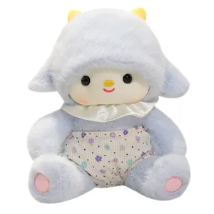Cute blue plush sheep toy wearing a floral outfit and white collar on white background