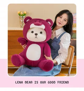 Close-up of a large Lena Bear plush toy held by a girl in a home setting